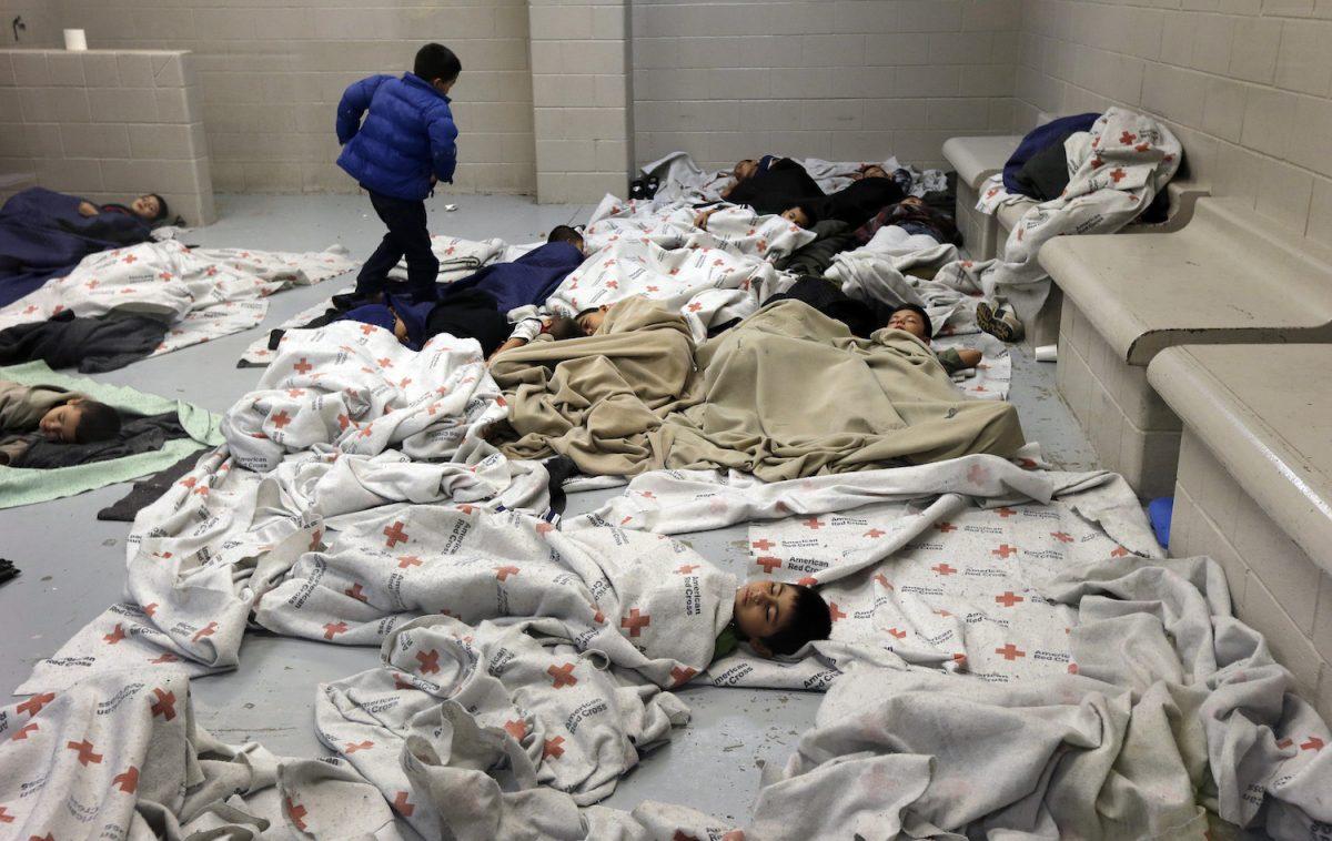 Detainees sleep in a holding cell at a U.S. Customs and Border Protection processing facility, on June 18, 2014, in Brownsville,Texas. Brownsville and Nogales, Ariz. have been central to processing the more than 47,000 unaccompanied children who have entered the country illegally since Oct. 1. (Eric Gay-Pool/Getty Images)
