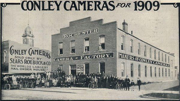 The Conley Camera Company factory and its workers in Rochester, Minn., as advertised in the 1909 Sears, Roebuck and Co. catalog. (Public Domain)