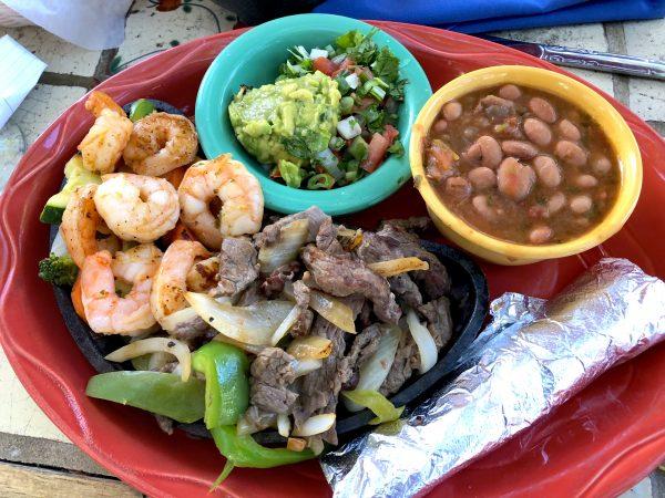 Hearty Shrimp and Beef Fajita, beans with fresh veggies, and guacamole at Las Casuelas Nuevas in Rancho Mirage. (Beverly Mann)
