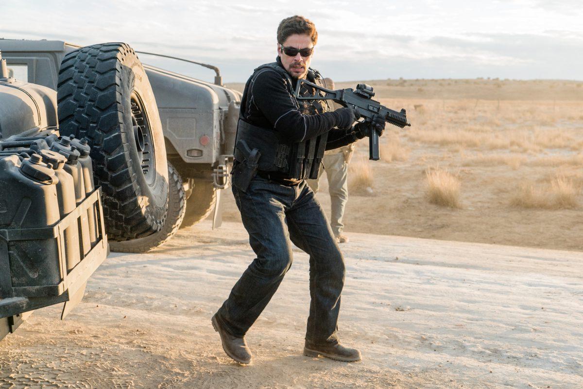 Alejandro (Benicio Del Toro) opens fire on the Mexican police ambushing the Humvee convoy in “Sicario 2: Soldado.” (Richard Foreman, Jr./Sony Pictures Releasing)