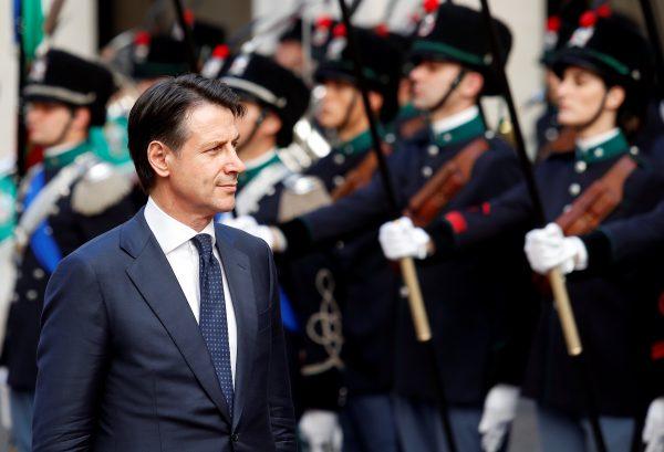 Italy's Prime Minister Giuseppe Conte reviews the guard of honour at Chigi palace in Rome, Italy, June 1, 2018. (Reuters/Alessandro Bianchi)