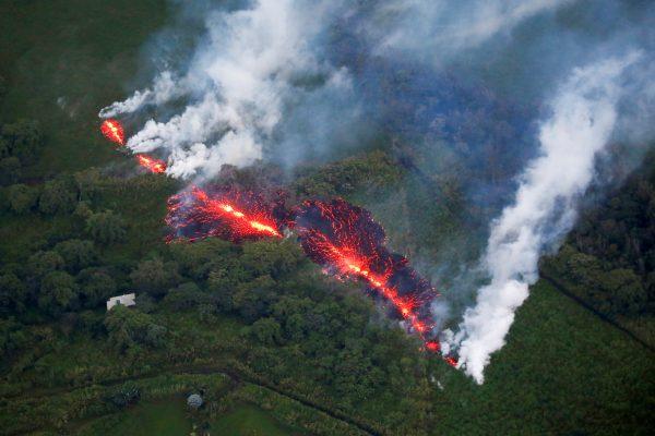 Lava erupts from a fissure east of the Leilani Estates subdivision during ongoing eruptions of the Kilauea Volcano in Hawaii, May 13. (Reuters/Terray Sylvester)