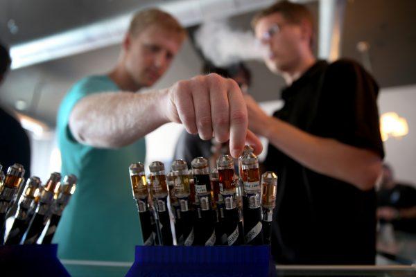 Jon Lusher and Bret Wagner try different flavors of electronic cigarette vapor in a file photo. (Joe Raedle/Getty Images)