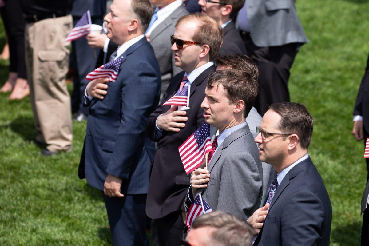 People sing the national anthem during the Celebration of America on the South Lawn of the White House in Washington on June 5, 2018. (Samira Bouaou/The Epoch Times)