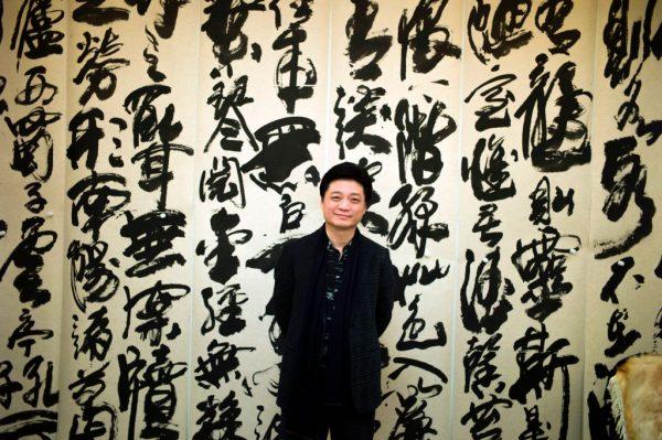 Chinese television host and producer Cui Yongyuan poses for photos at his workshop in Beijing on March 7, 2017. (Fred Dufour/AFP/Getty Images)