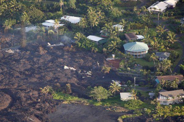 Lava destroys homes in the Kapoho area, east of Pahoa, during ongoing eruptions of the Kilauea Volcano in Hawaii, U.S., June 5, 2018. (Reuters/Terray Sylvester)