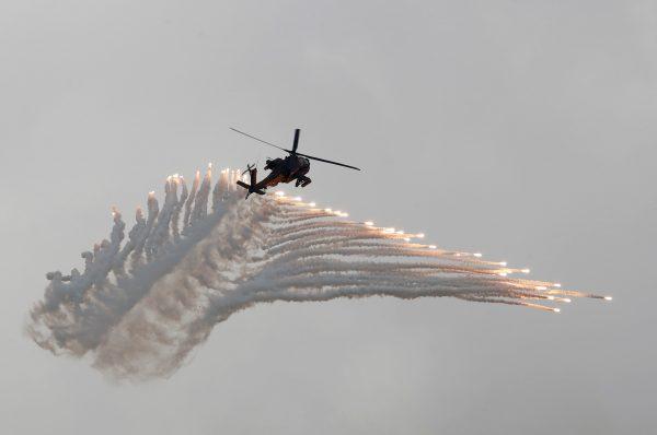 An AH-64 Apache helicopter fires flares during the Han Kuang military drills simulating the Chinese military invading the island, at the Ching Chuan Kang Air Base, in Taichung, Taiwan, on June 7, 2018. (Tyrone Siu/Reuters)