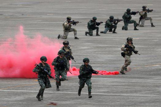 Soldiers takes part in the Han Kuang military drills simulating the Chinese military invading the island, at Ching Chuan Kang Air Base, in Taichung, Taiwan, on June 7, 2018. (Tyrone Siu/Reuters)