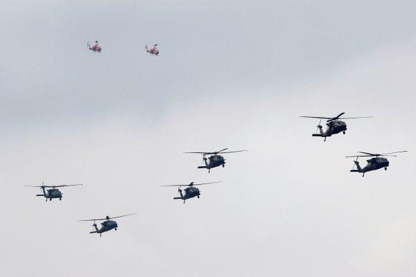 UH-60M Black Hawk helicopters and AH-1 Cobra helicopters take part in the Han Kuang military drills simulating the Chinese military invading the island, at Ching Chuan Kang Air Base, in Taichung, Taiwan, on June 7, 2018. (Tyrone Siu/Reuters)