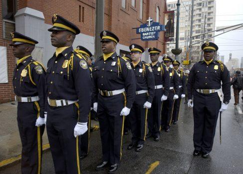 Members of the Atlanta Police Department Honor Guard stand at attention in a 2006 file photo. Police in Atlanta, Georgia, recently assisted in an operation to rescue children from traffickers. (Stephen Morton/Getty Images)
