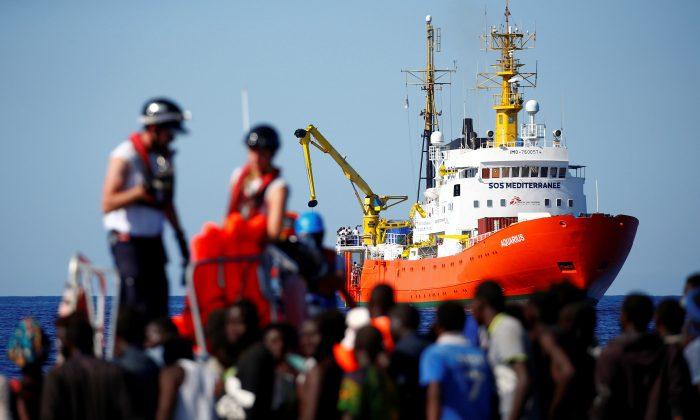 Activists Protest as Italy Prepares to Ship Migrants to Spain