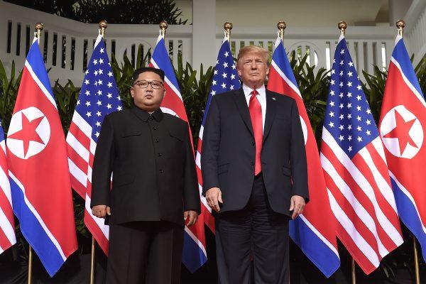 President Donald Trump poses with North Korea's leader Kim Jong Un at the start of their historic US-North Korea summit, at the Capella Hotel on Sentosa Island in Singapore on June 12, 2018. (SAUL LOEB/AFP/Getty Images)