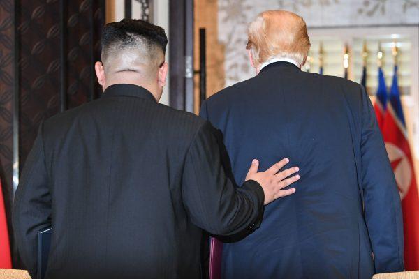 North Korea's Kim Jong Un and President Donald Trump leave following a signing ceremony during their summit in Singapore on June 12, 2018. (SAUL LOEB/AFP/Getty Images)