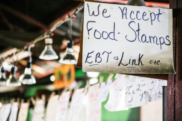A store accepting food stamps. ("We Accept Food Stamps" by Paul Sableman/Flickr [CC BY 2.0 (ept.ms/2haHp2Y)])
