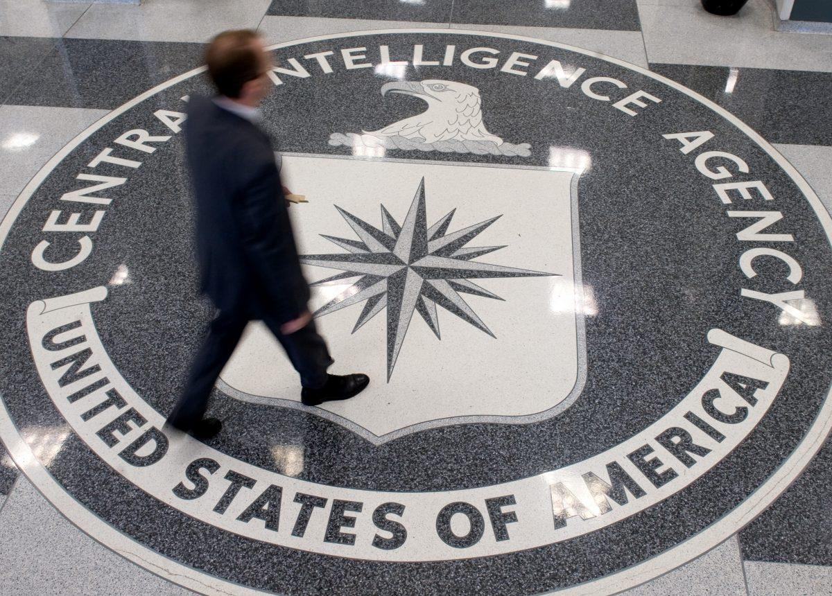 A man crosses the Central Intelligence Agency (CIA) seal in the lobby of the CIA Headquarters in Langley, Virginia, in a file photograph. (Saul Loeb/AFP/Getty Images)