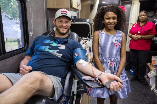 Tymia with a donor. (Courtesy of Mic Smith/American Red Cross)