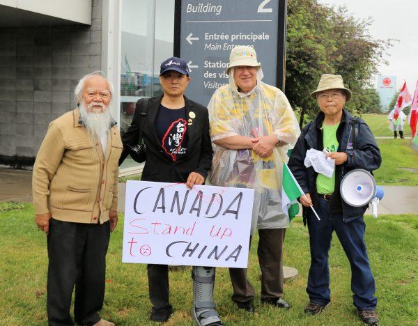(L-R) Albert J.F. Lin, Jianming Chen, president of the Taiwanese Canadian Association of Greater Montreal, Michael Stainton president of the Taiwanese Human Rights Association of Canada, Edward Chung, a convener for the Association of Taiwanese Organizations in Toronto. Protesters gathered in front of Air Canada’s headquarters in Montreal on June 14, 2018 to voice their objection to the airline's move to list Taiwan as part of China on its website. (Yi Ke/The Epoch Times)