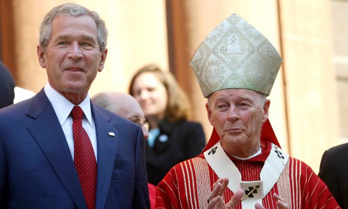 President George W. Bush and Cardinal Theodore McCarrick, Archbishop of Washington, look on after the 52nd Annual Red Mass at St. Matthews Cathedral in Washington on Oct. 2, 2005. (G. Fabiano-Pool/Getty Images)