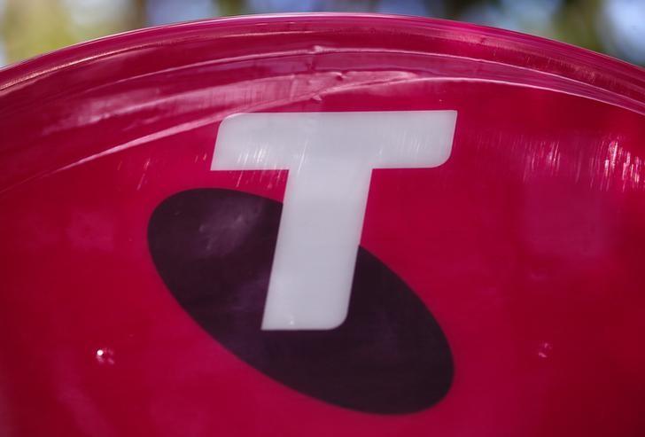 A Telstra logo adorns a phone booth in the central business district (CBD) of Sydney in Australia, on Feb. 13, 2018. (Reuters/David Gray)