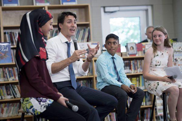 Prime Minister Justin Trudeau speaks to students at Berrigan Elementary School at an event marking Multiculturalism Day in Ottawa on June 27, 2017. (The Canadian Press/Justin Tang)