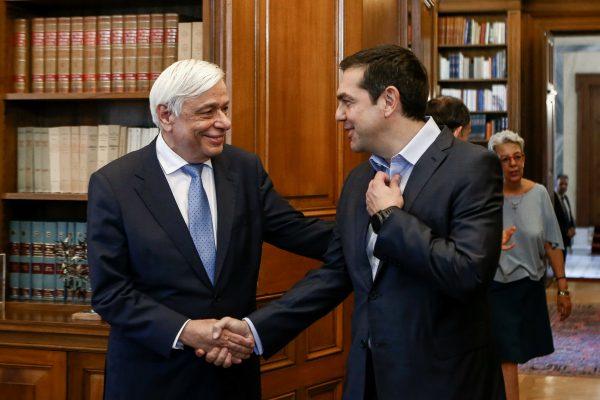 Greek Prime Minister Alexis Tsipras (R) shakes hands with Greek President Prokopis Pavlopoulos during a meeting at the presidential palace in Athens, Greece, June 22, 2018. (Panayiotis Tzamaros/Intimenews via Reuters)