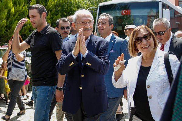Turkey's Republican People's Party (CHP) politician Kemal Kilicdaroglu (C), his wife Selvi (R), and his son Kerem (L) gesture after voting at a polling station during presidential and parliamentary elections in Ankara, Turkey, on June 24, 2018. (Mustafa Kirazli/Getty Images)