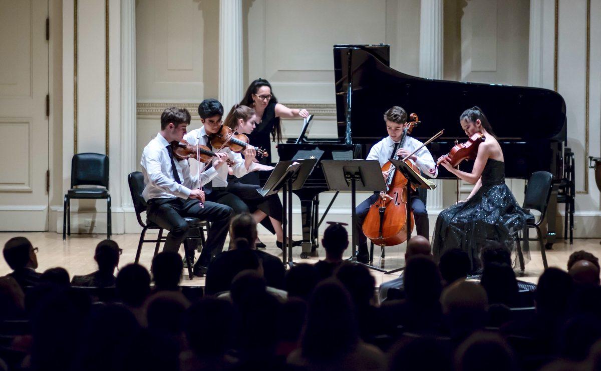 <span style="color: #000000;">The MSM piano quintet</span> Threescore features NY Concerti Sinfonietta returning Shining Stars (L–R) Daniel Rafimayeri and Ari Boutris on violins; Jane Bua on piano; Julie Jordan, the founder and artistic director of the New York Concerti Sinfonietta; Alexander Rohatyn on cello; and Coco Mi on viola. (James Eden)