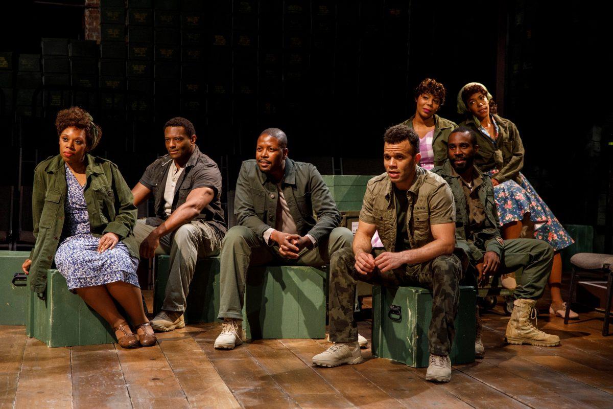 The supporting cast of “Carmen Jones” as GIs and factory girls: (L–R) Andrea Jones-Sojola, David Aron Damane, Lawrence E. Street, Justin Keyes, Soara-Joye Ross, Tramell Tillman, and Erica Dorfler. The production is set in World War II in the American South. (Joan Marcus)