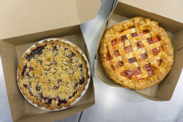 The author's perfectly imperfect cherry and strawberry rhubarb pies. (Crystal Shi/The Epoch Times)