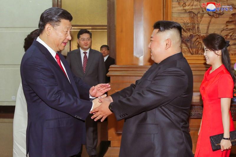 Chinese leader Xi Jinping shakes hands with North Korean leader Kim Jong Un in Beijing in this undated photo released by North Korea’s Korean Central News Agency on June 20, 2018. (KCNA via Reuters)