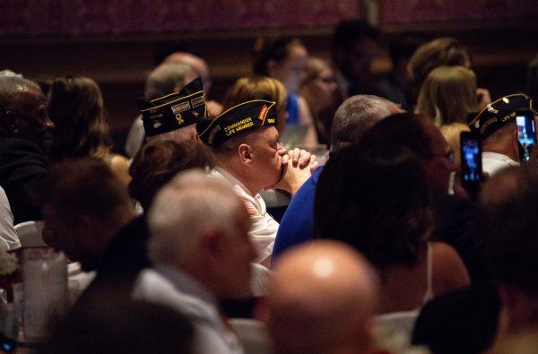 A veteran listens to President Donald Trump speak at the Salute to Service Dinner in White Sulphur Springs, W. Va., on July 3, 2018. (Samira Bouaou/The Epoch Times)