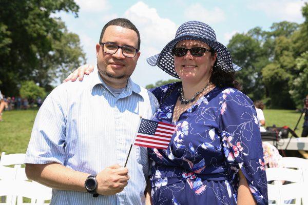 Jose Collado from the Dominican Republic, who just became an American citizen, poses with his wife Evelyn after a naturalization ceremony at President George Washington's historic home in Mount Vernon, Va., on July 4, 2018. (Samira Bouaou/The Epoch Times)