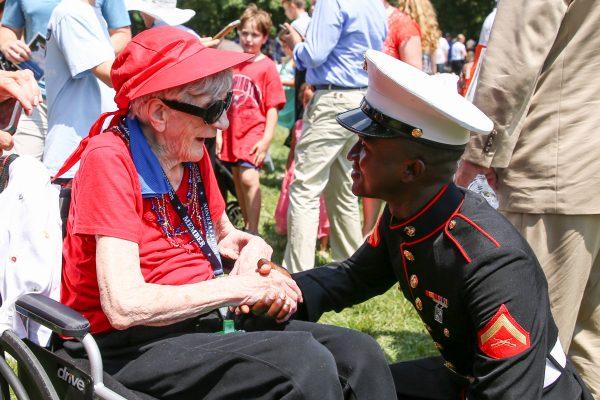 Elizabeth Zangel, soon to be 101 years old, congratulates new American citizen Marine Diallo Daouda at a naturalization ceremony at President George Washington's historic home in Mount Vernon, Va., on July 4, 2018. (Samira Bouaou/The Epoch Times)