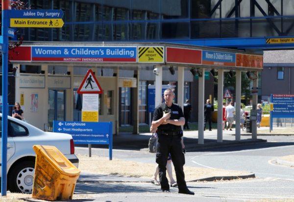 A security officer stands outside the entrance to the Countess of Chester Hospital, Chester, Britain, on July 3, 2018. (Andrew Yates/Reuters)