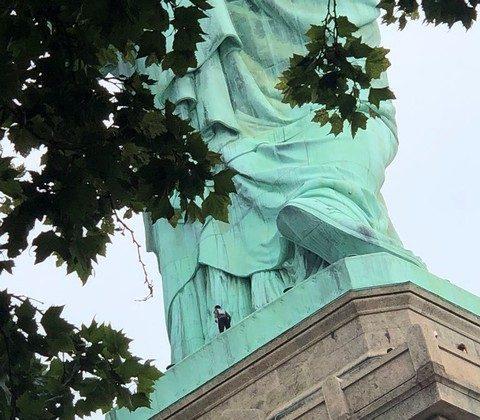 Woman Plucked From Lady Liberty’s Foot, Ending Standoff
