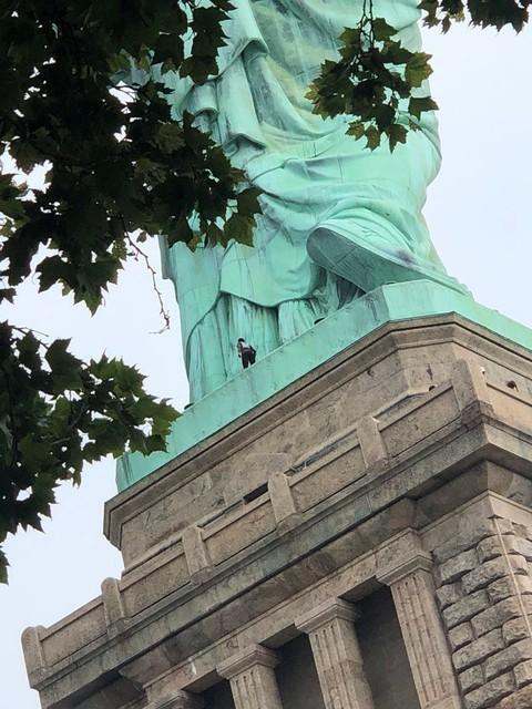 Woman Plucked From Lady Liberty’s Foot, Ending Standoff