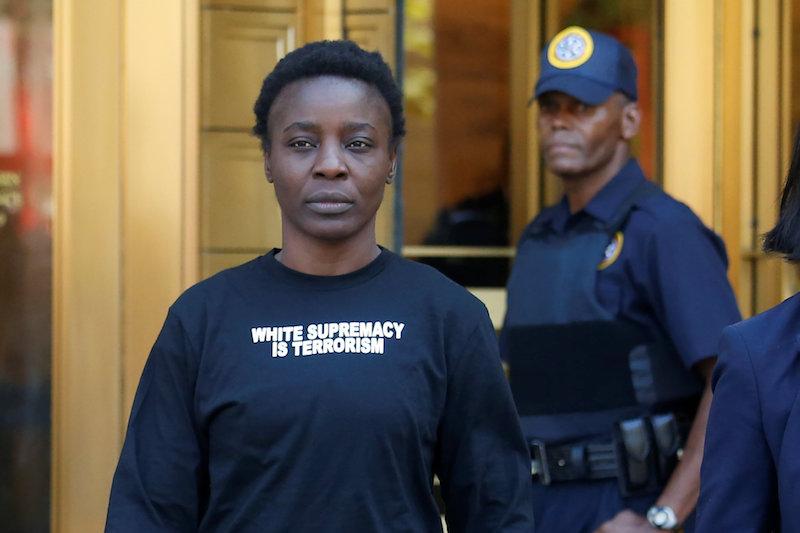 Patricia Okoumou walks out of federal court from her arraignment, a day after authorities say she scaled the stone pedestal of the Statue of Liberty, in Manhattan, New York, on July 5, 2018. (Shannon Stapleton/Reuters)