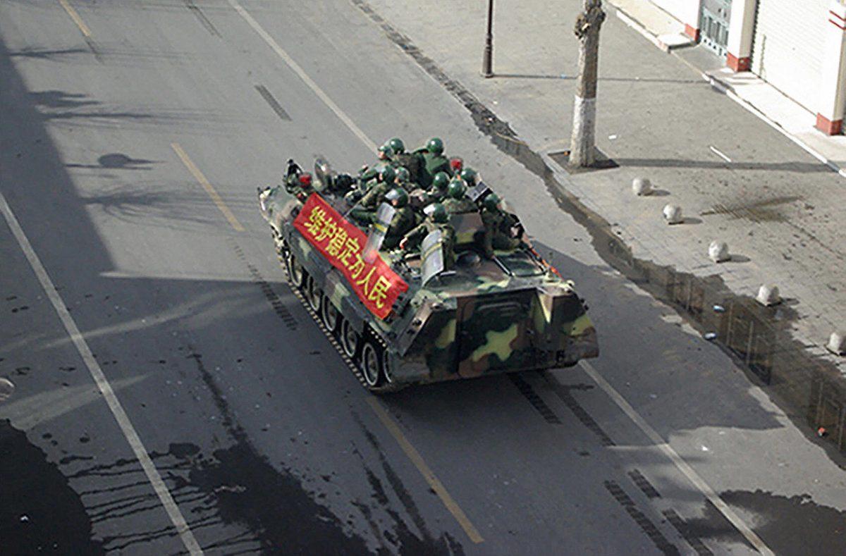 In this picture taken in Lhasa on March 16, 2008, Chinese soldiers patrol a street in Lhasa, Tibet on March 16, 2008. Prior to the 2008 Beijing Olympics, Tibet suffered a brutal crackdown. (KIM JAE-HWAN/AFP/Getty Images)