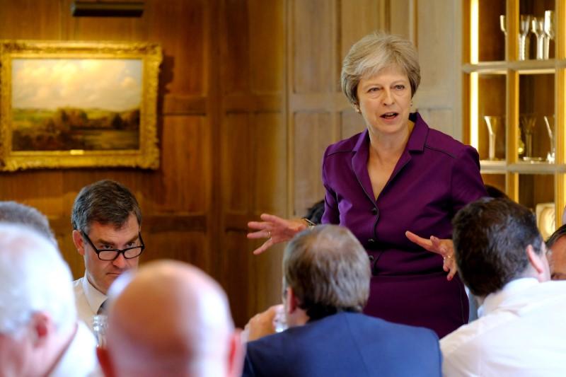 May Secures Support From UK Government on ‘Soft Brexit’ Plan