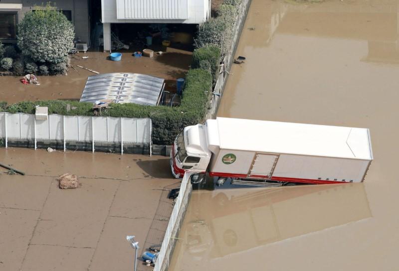 A truck which was stranded by floods is pictured at Mabi town in Kurashiki, Okayama Prefecture, Japan, in this photo taken by Kyodo July 9, 2018. (Kyodo/via Reuters)
