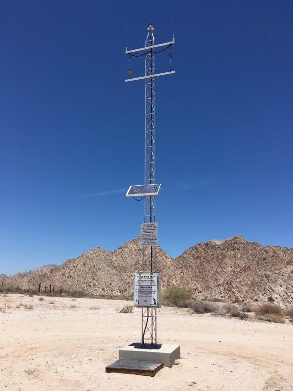 An emergency beacon located in the desert east of Yuma, Ariz., a couple of miles from the U.S.-Mexico border on May 25, 2018. (Charlotte Cuthbertson/The Epoch Times)