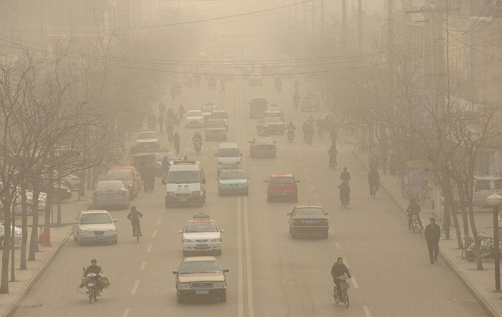 Smog down a main street of Linfen, a city in China's Shanxi Province, on Dec. 9, 2009. (Peter Parks/AFP/Getty Images)