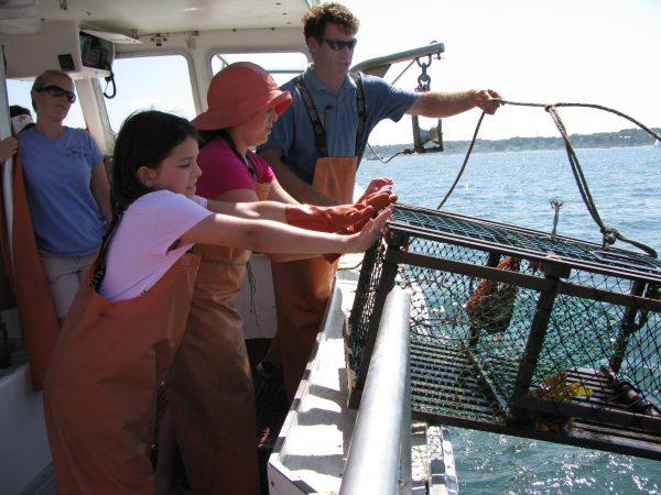 Working lobster fisherman Captain Tom teaches guests to bait and haul lobster traps. (Courtesy of Inn by the Sea)
