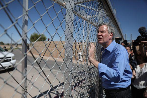 New York City Mayor Bill de Blasio stops at a gate after being told he could not cross through the gate to the tent facility setup at the Marcelino Serna Port of Entry as he joins with other mayors from the U.S. Conference of Mayors on the border to protest President Donald Trump's immigration policy in Fabens, Texas, on June 21, 2018. (Joe Raedle/Getty Images)