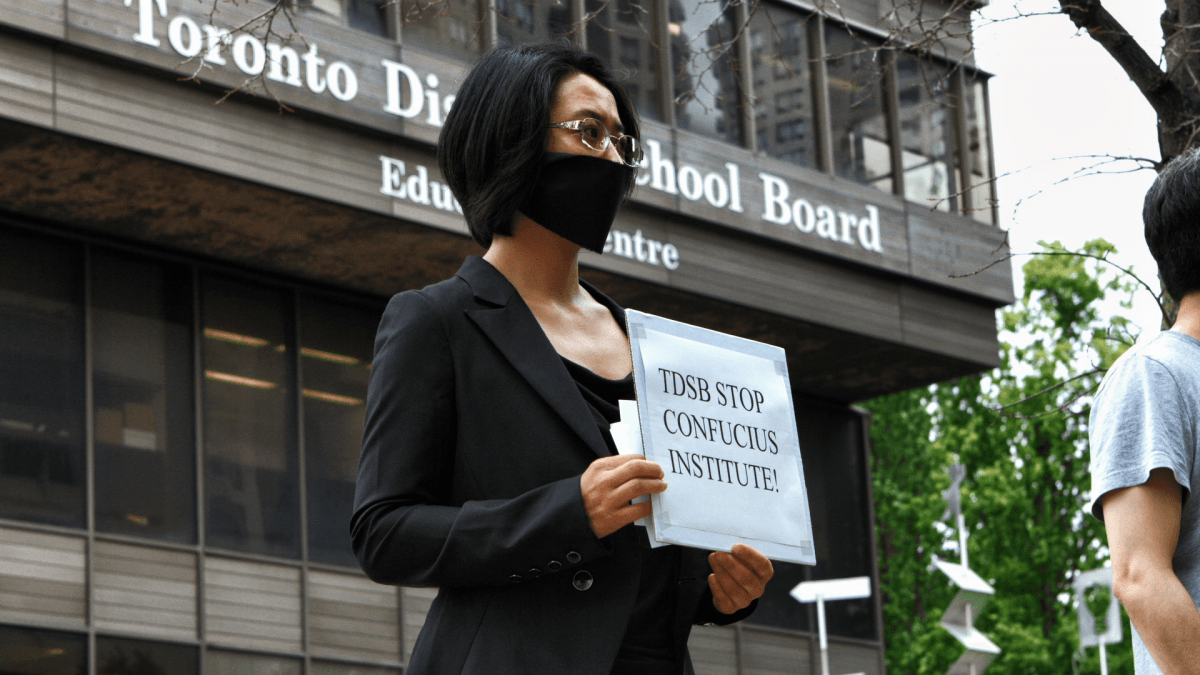 Former Confucius Institute teacher Sonia Zhao demonstrates against the Confucius Institutes outside the Toronto District School Board. (Mark Media)