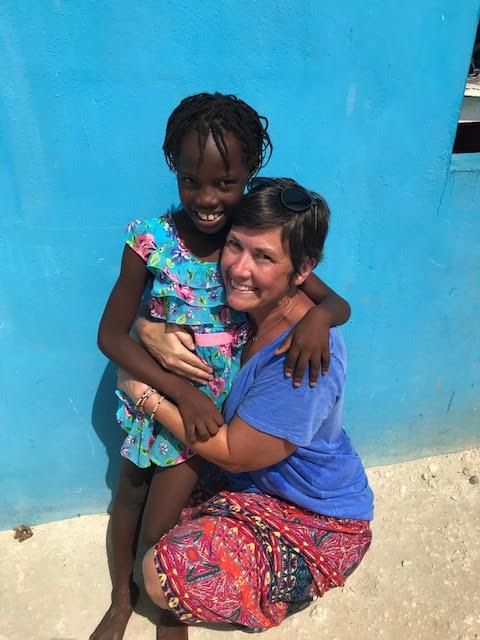Team leader Emily Wheaton with a child in Haiti. (Courtesy of Emily Wheaton)