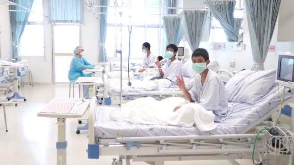 A screen grab shows boys rescued from the Thai cave wearing mask and resting in a hospital in Chiang Rai, Thailand from a July 11, 2018 handout video. (Government Public Relations Department (PRD) and Government Spokesman Bureau/Handout via Reuters TV)