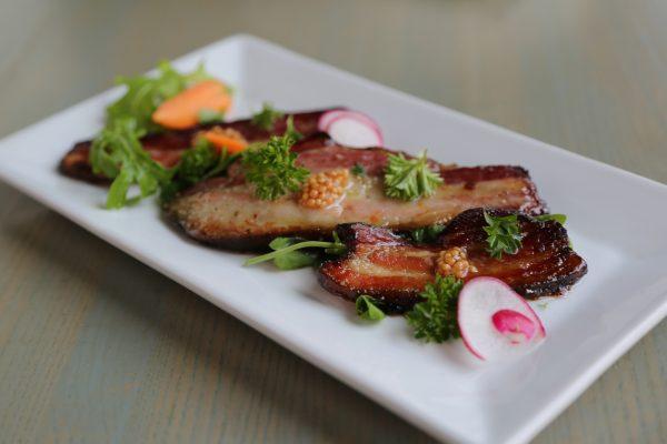 Nicks on Broadway's house-smoked bacon, made with local pork, with cider and punchy dollops of whole-grain mustard. (Channaly Philipp/The Epoch Times)