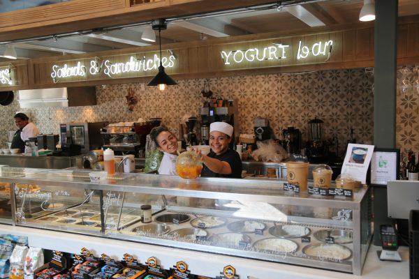 The Greek yogurt bar at Yoleni's, where flavors like apricot and honey coffee await toppings from fresh fruit to chia seeds to candied orange peels. (Channaly Philipp/The Epoch Times)