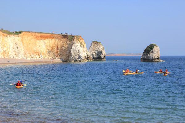 Kayakers at Freshwater Bay, a small cove on the southern coast of the island. (Wibke Carter)